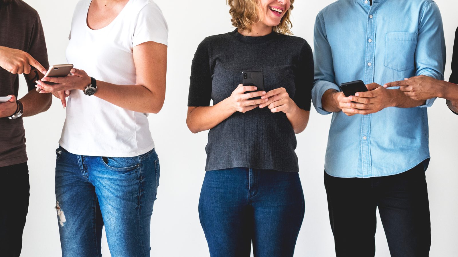 A young sales team on their phones